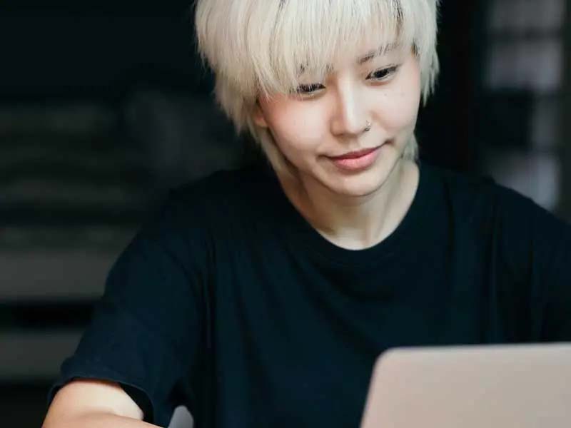 a student doing work on a laptop computer